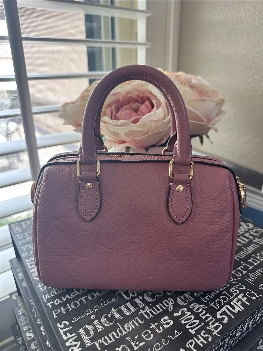 Coach mini Rowan signature leather in the color peony